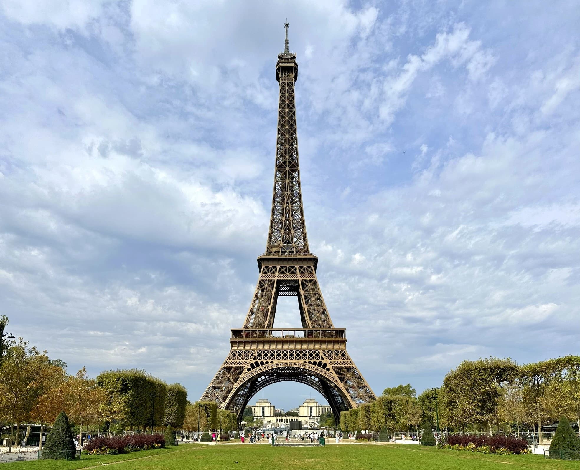 The Eiffel Tower from the Left Bank: lawns, base, and the river